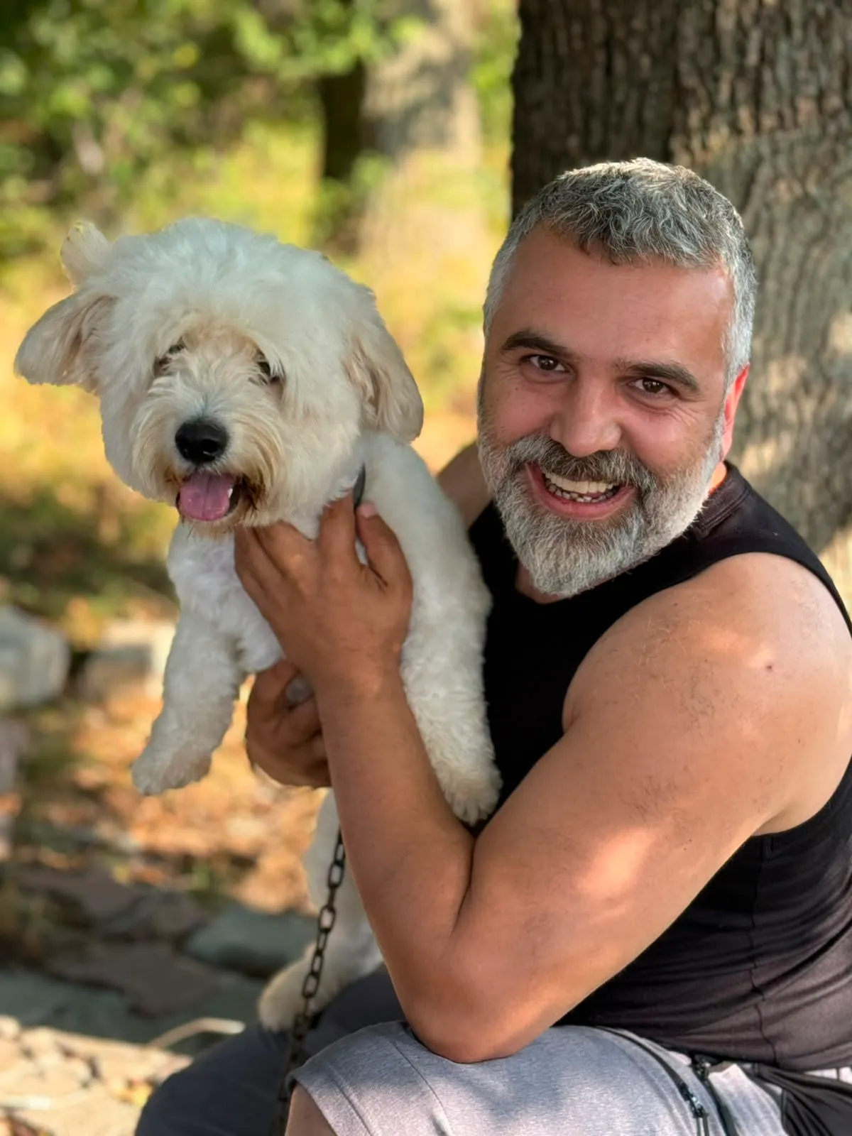 A guest holding their dog at PatiLee